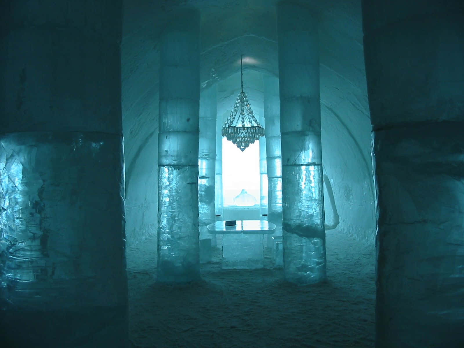 A Mesmerizing View Of The Ice Hotel With Intricate Ice Sculptures In The Heart Of Winter Wallpaper