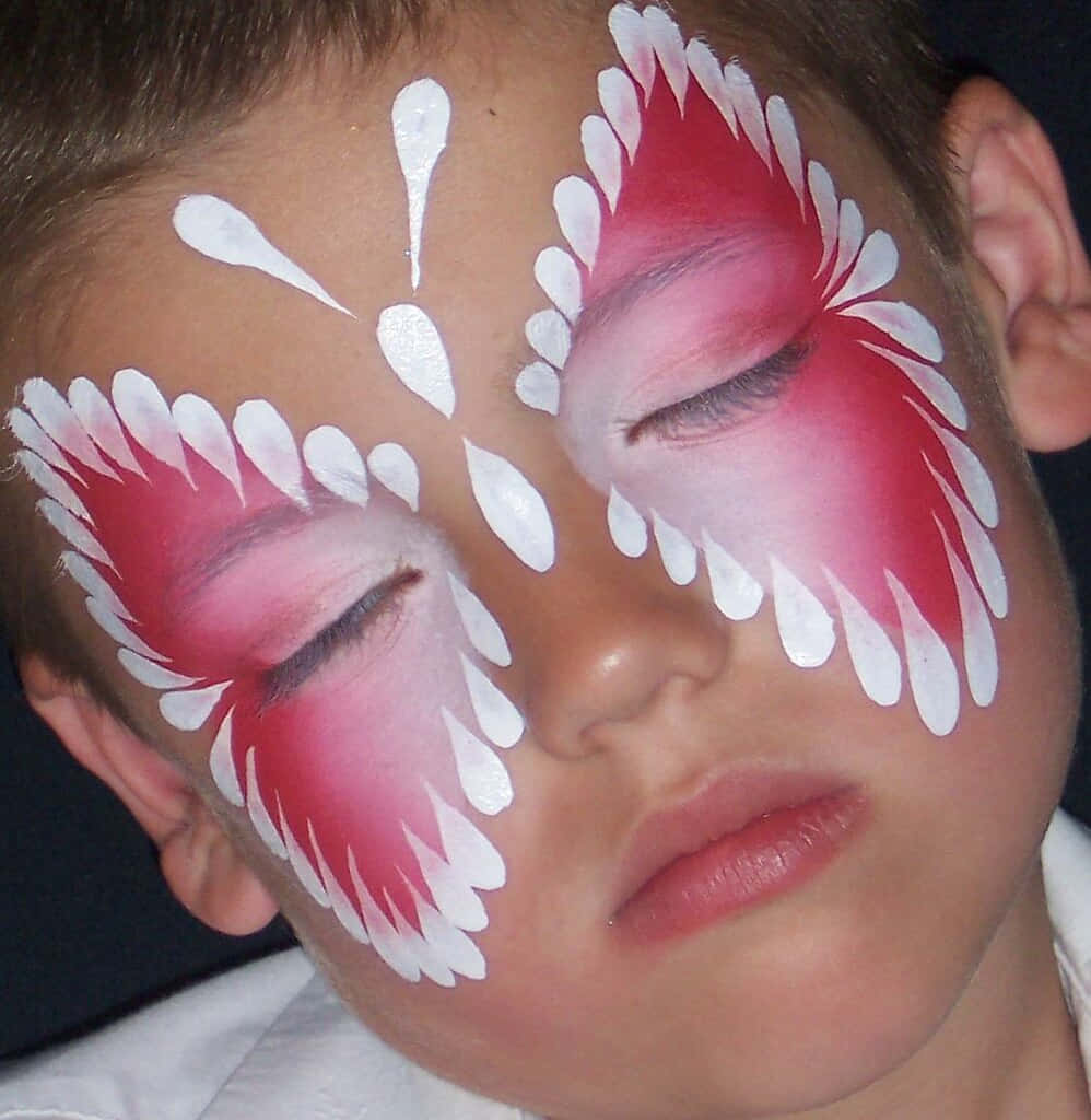 A Model Showcasing A Butterfly Face Painting Design Wallpaper