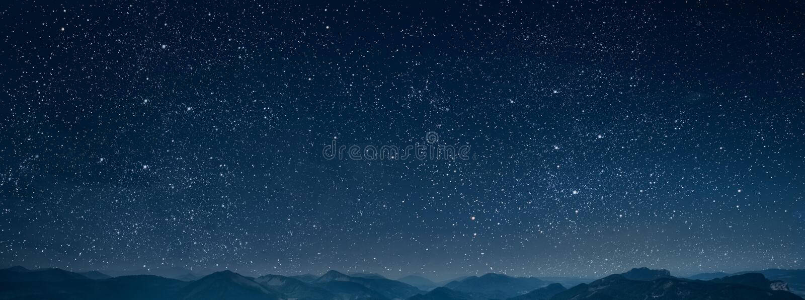 A Nighttime View Of The Majestic Mountains Wallpaper