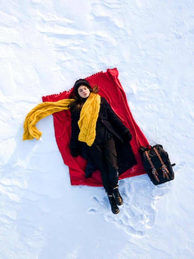 A Pair Of Snowshoes Beautifully Lying On The Snow Wallpaper