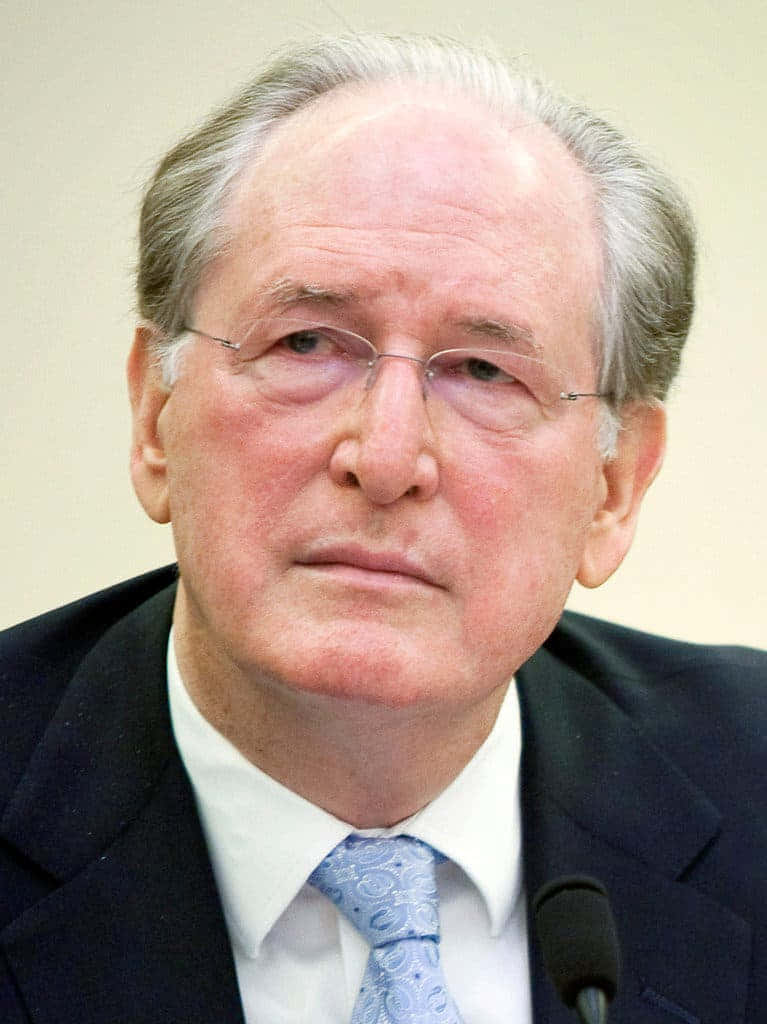 A Pensive Jay Rockefeller Engaging In A Conversation Wallpaper