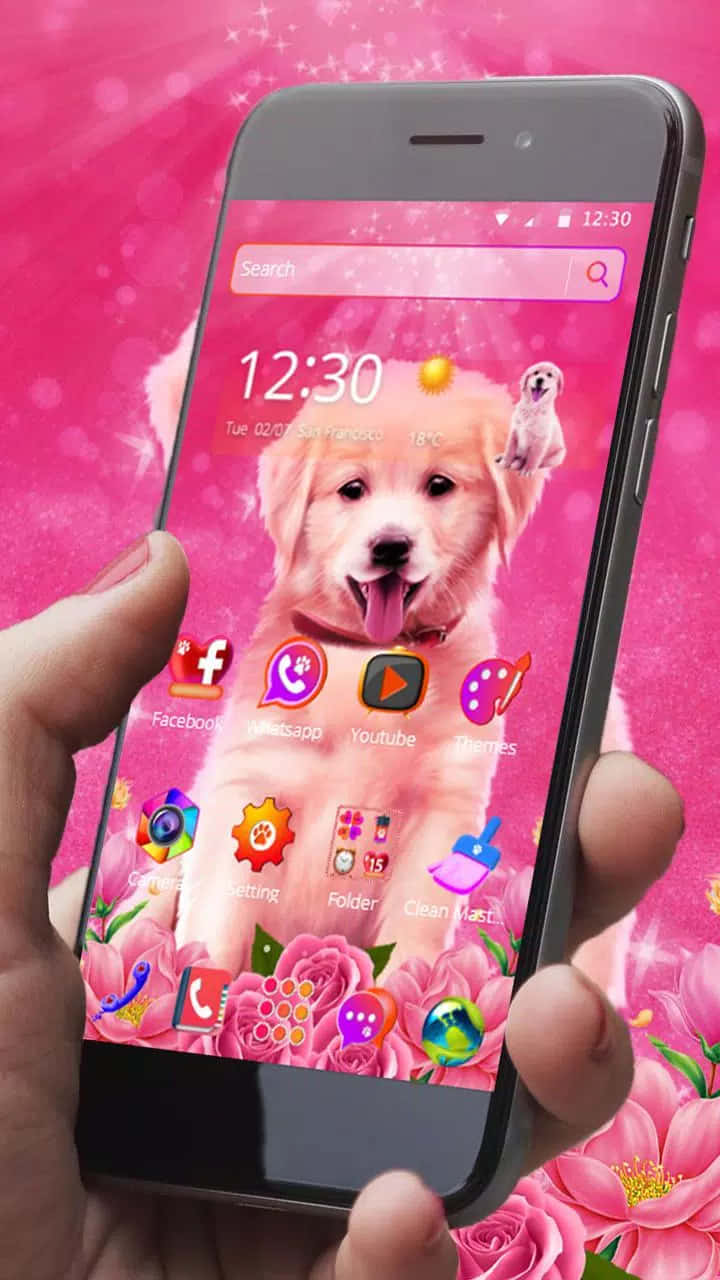 A Person Holding A Pink Phone With A Puppy On It Wallpaper