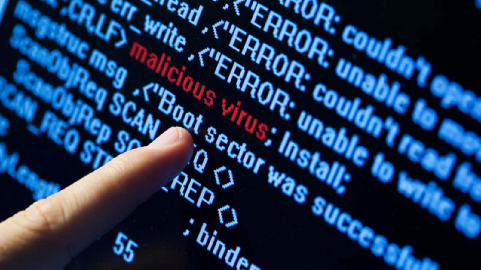 A Person Is Pointing At A Computer Screen With A Virus On It Wallpaper