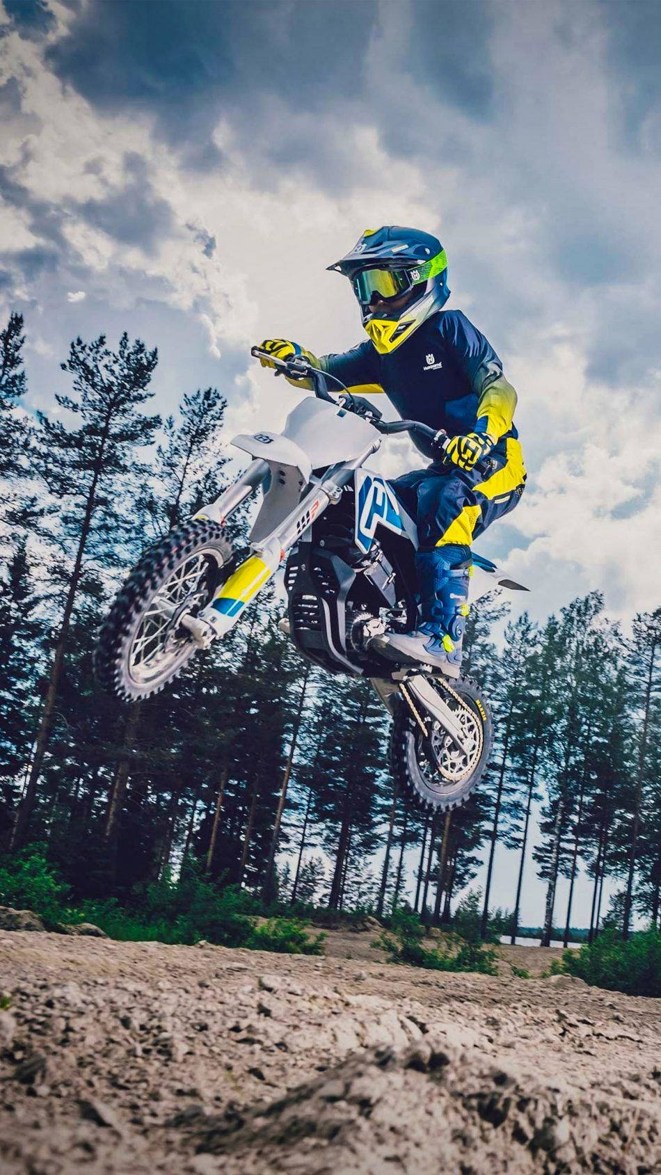 A Person Riding A Dirt Bike In The Air Wallpaper