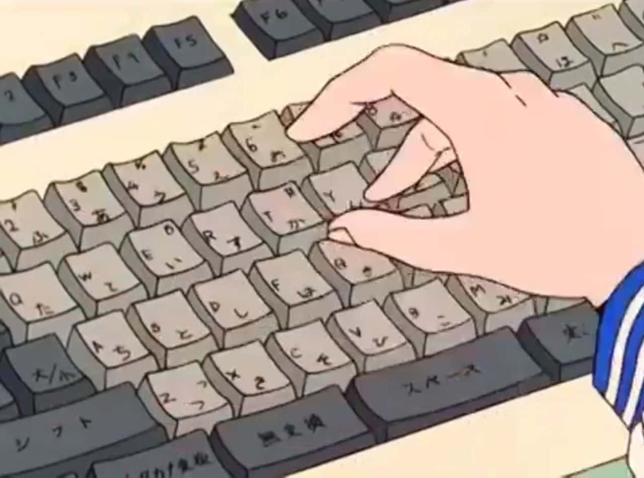 A Person's Hand Is Typing On A Keyboard Wallpaper