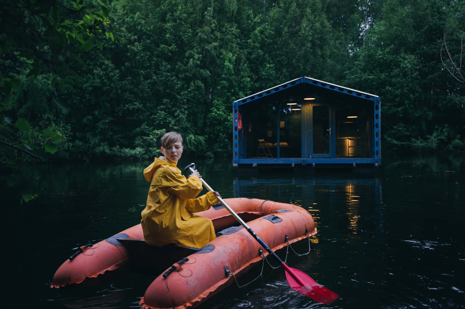 A Person Wearing A Vibrant Yellow Raincoat During A Rainy Day Wallpaper