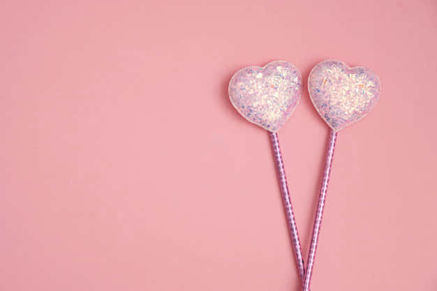 A Pink, Glittery Cascade Of Heart-shaped Confetti Wallpaper