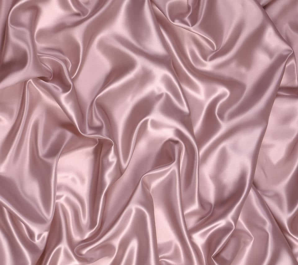 A Pink Satin Fabric With A Smooth Texture Wallpaper