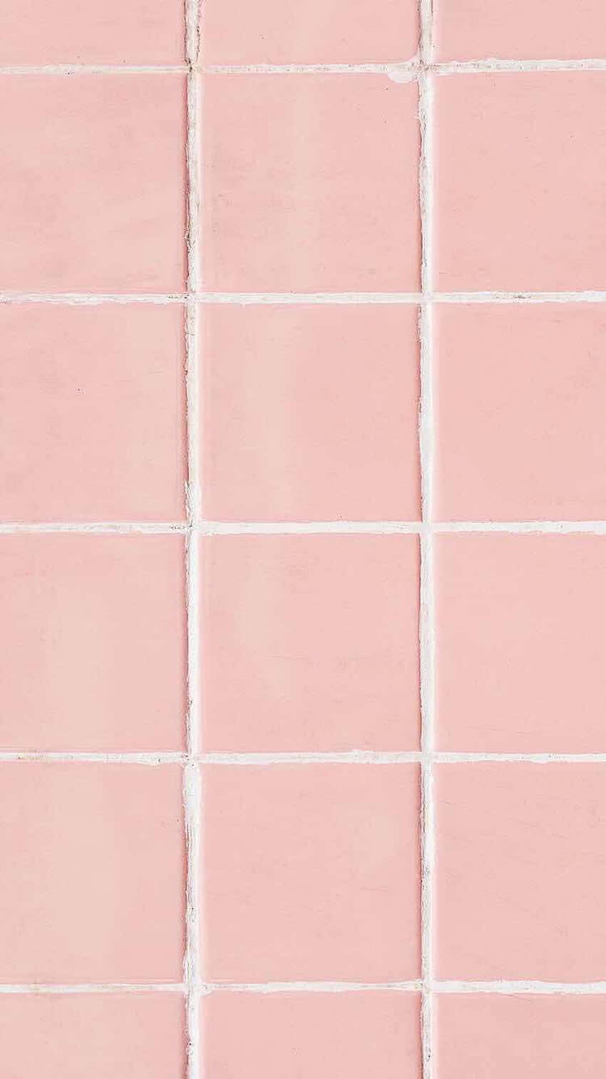 A Pink Tile With White Squares On It Wallpaper