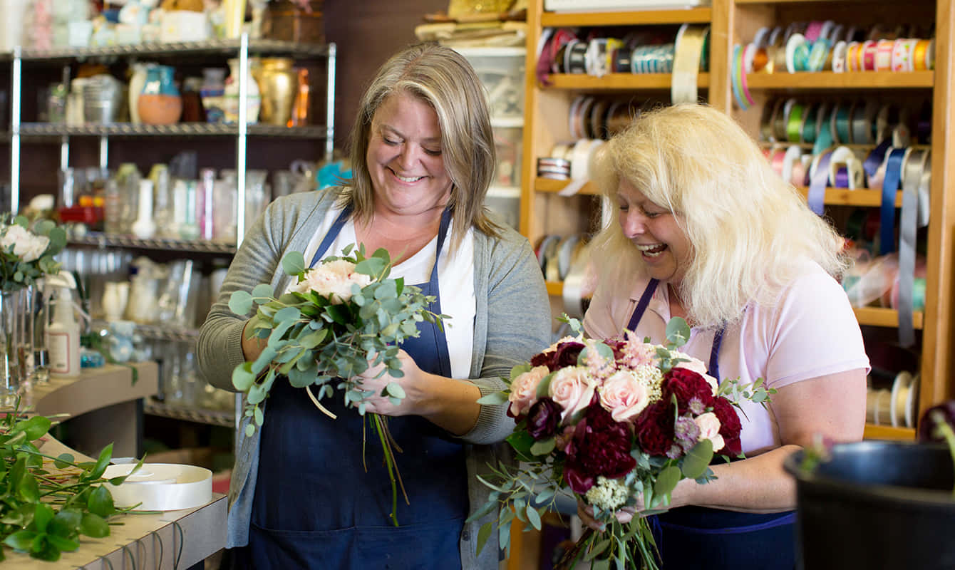 A Professional Florist Creates A Beautiful Bouquet. Wallpaper