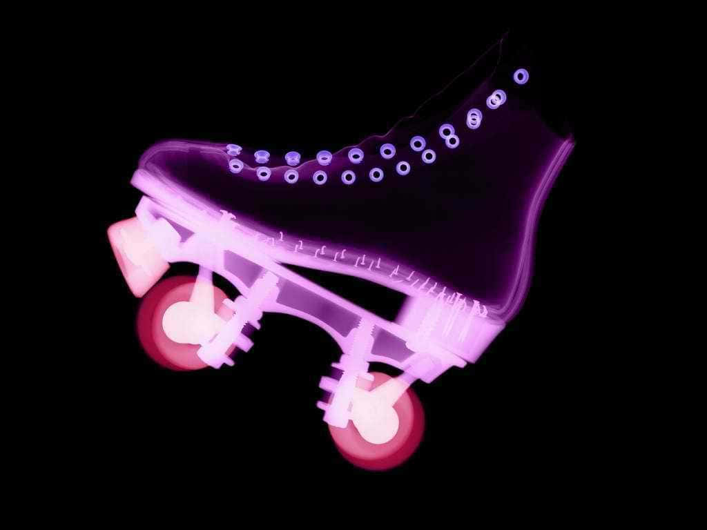 A Purple Roller Skate With A Black Background Wallpaper