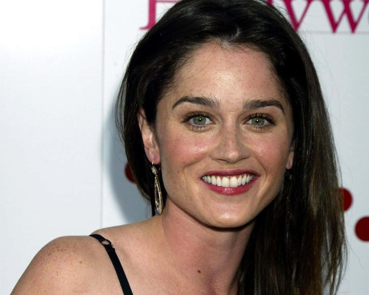 A Radiant Robin Tunney Smiling In A Close-up Portrait Wallpaper