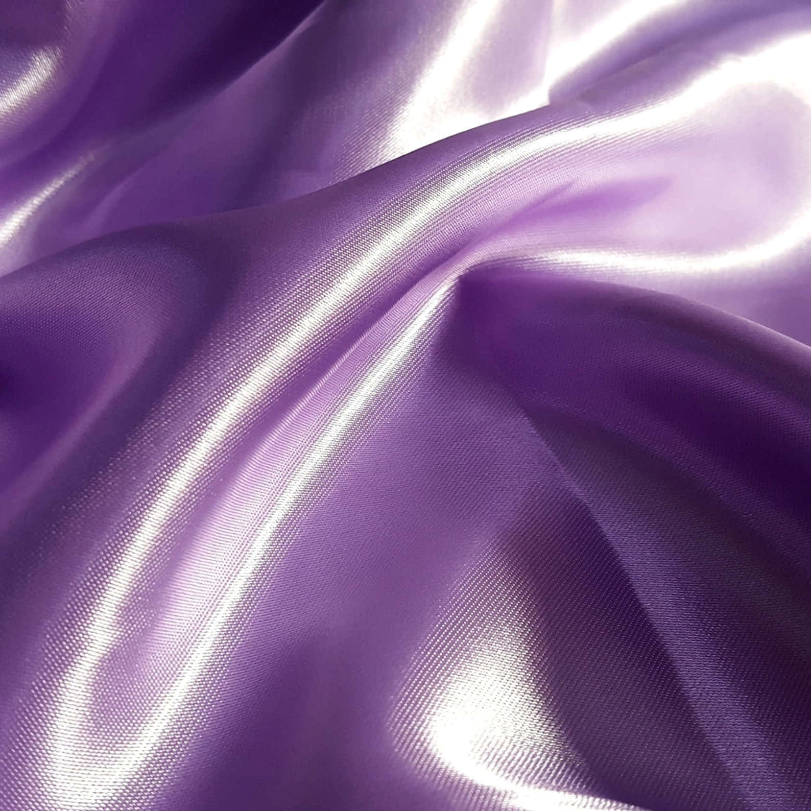 A Rich And Luxurious Purple Satin Fabric Wallpaper