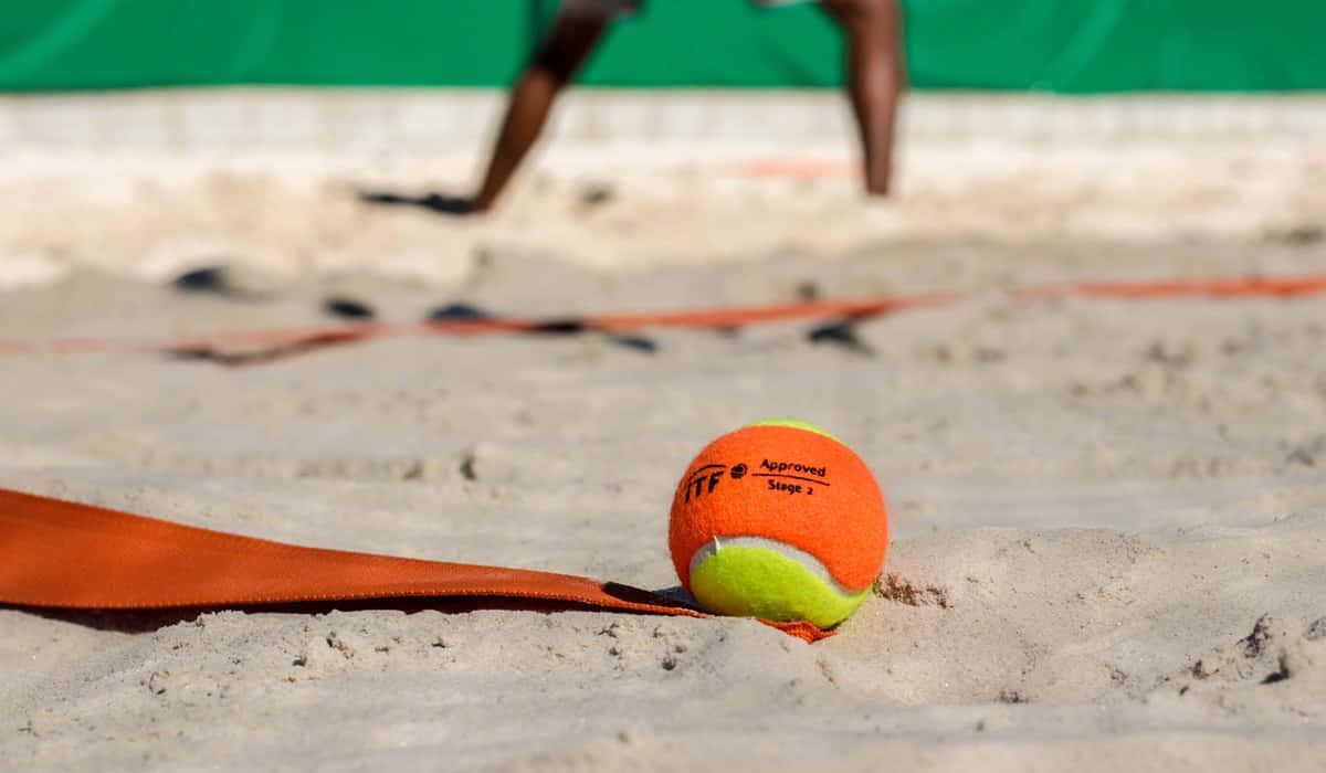 A Riveting Game Of Beach Tennis Wallpaper