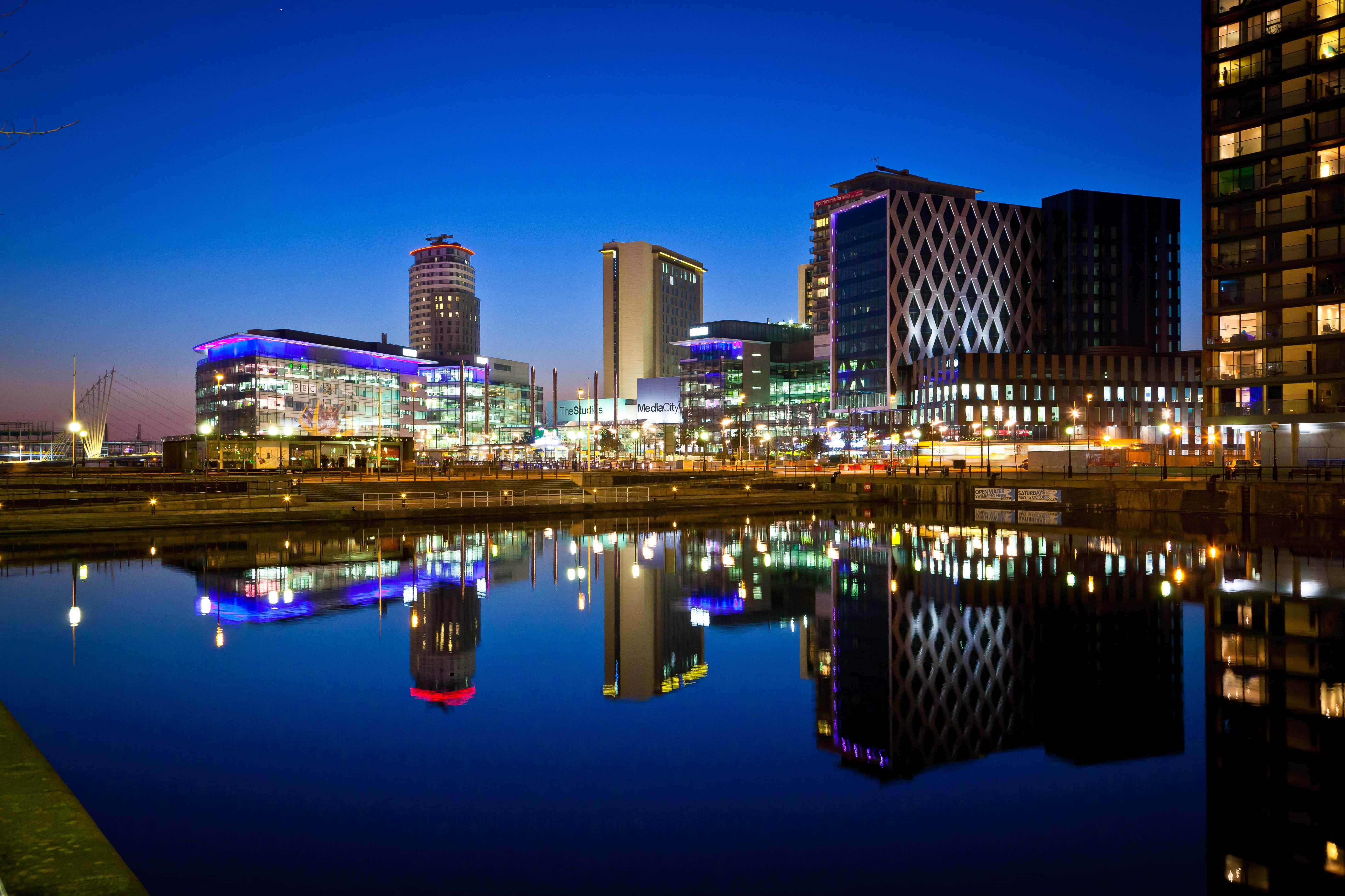 A Scenic View Of Salford City At Sunset Wallpaper