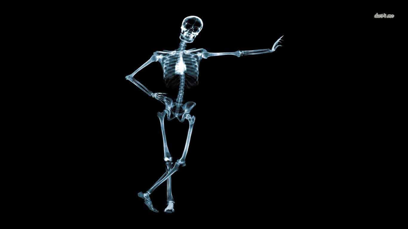 A Skeleton Is Standing On A Black Background Wallpaper