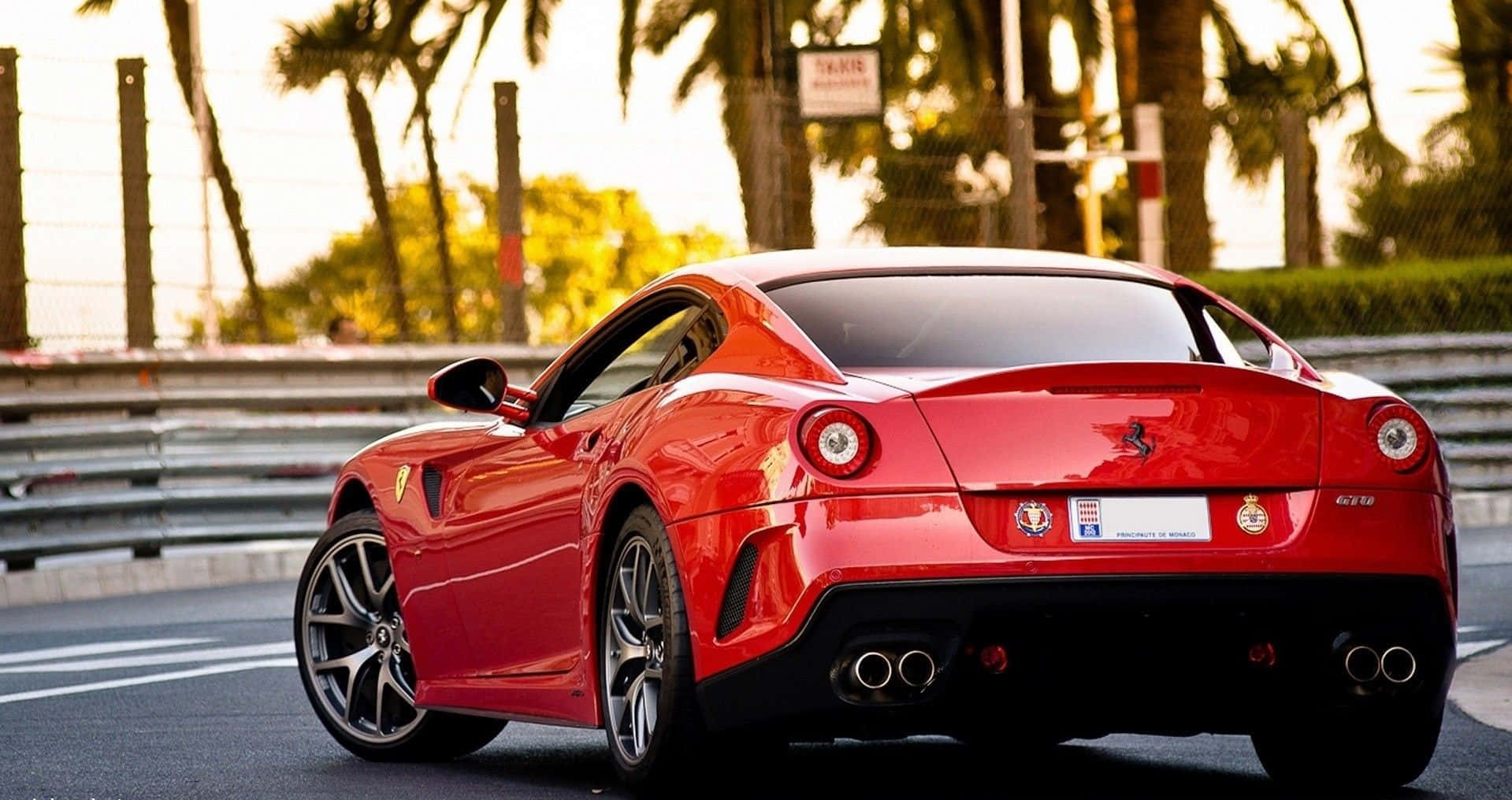 A Sleek Ferrari 599 Gtb Fiorano In Action Wallpaper