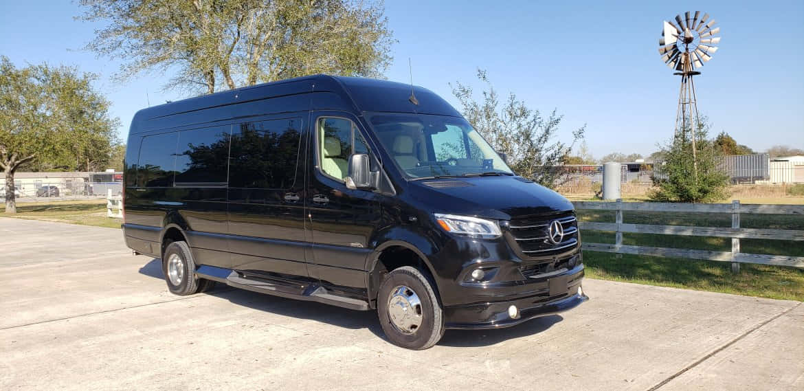 A Sleek Mercedes Benz Sprinter On The Road Wallpaper