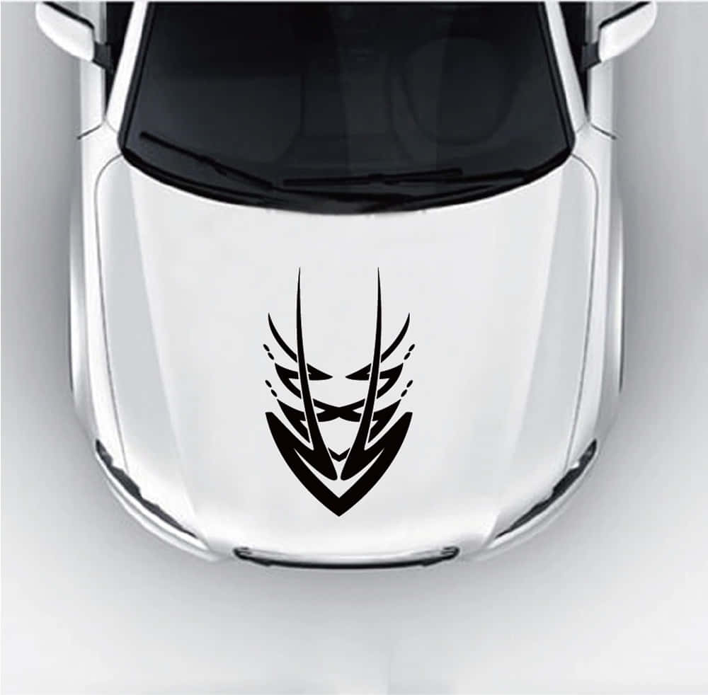 A Sleek Sports Car With Stunning Hood Design Captured On A Sunny Day Wallpaper