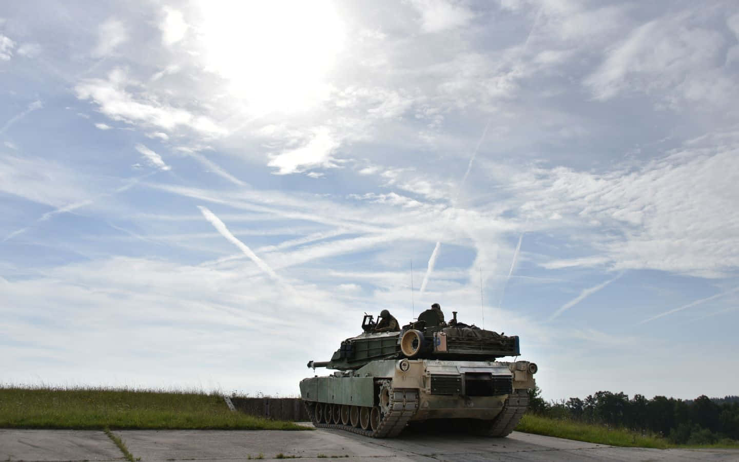 A Squadron Of Armored Tanks In A Desert Environment Wallpaper