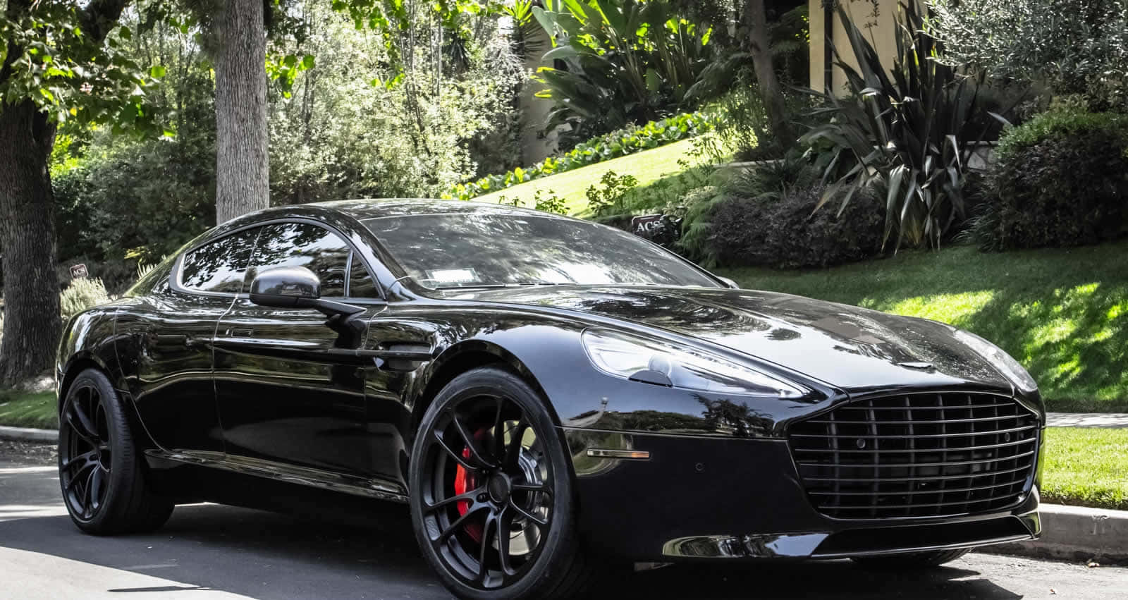 A Stunning Aston Martin Rapide S In Action Wallpaper