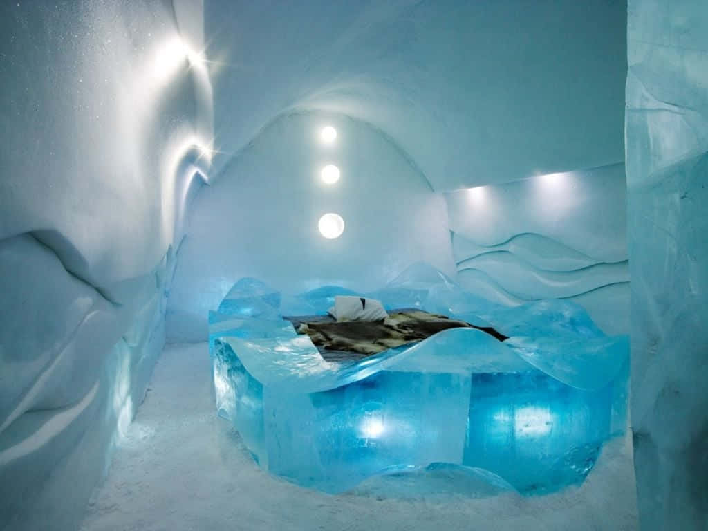 A Stunning Ice Hotel Suite With Intricate Ice Sculptures Wallpaper