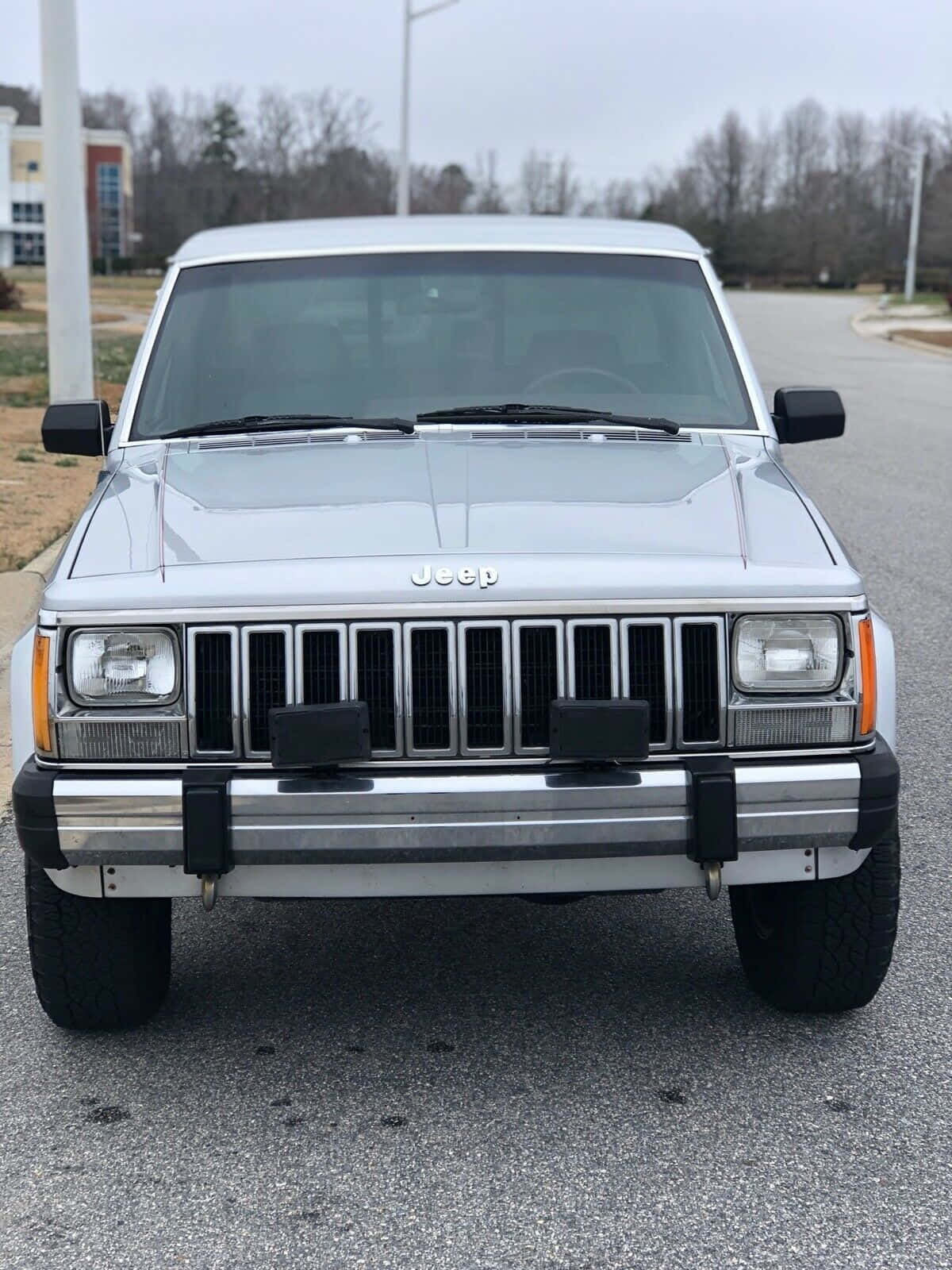 A Stunning Jeep Comanche Off-roading In A Rugged Terrain Wallpaper