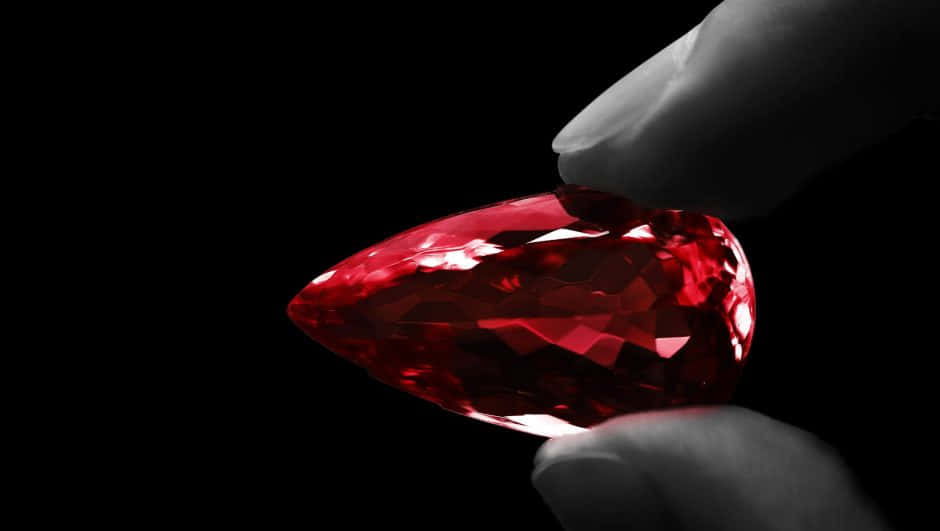 A Stunning Red Diamond In Spotlight Wallpaper