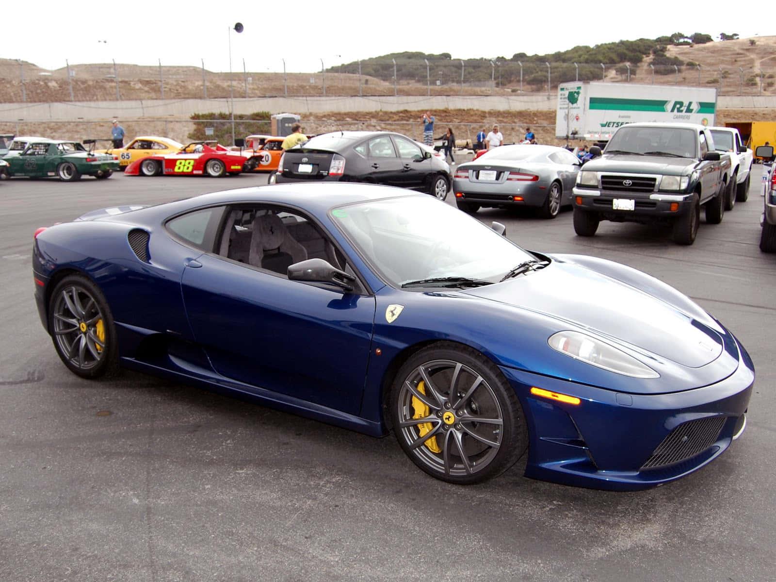 A Stunning Red Ferrari F430 At Full Speed Wallpaper