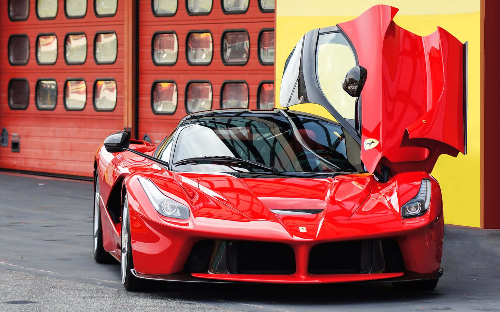 A Stunning Red Ferrari Laferrari In Motion Wallpaper