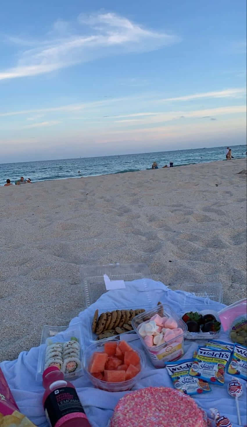 A Sunny Beach Picnic With Friends And Family Wallpaper