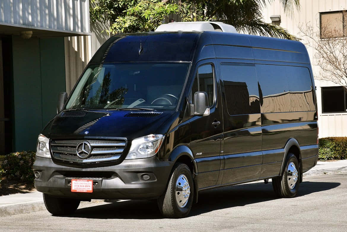 A Superb Mercedes Benz Sprinter On A Scenic Road Wallpaper