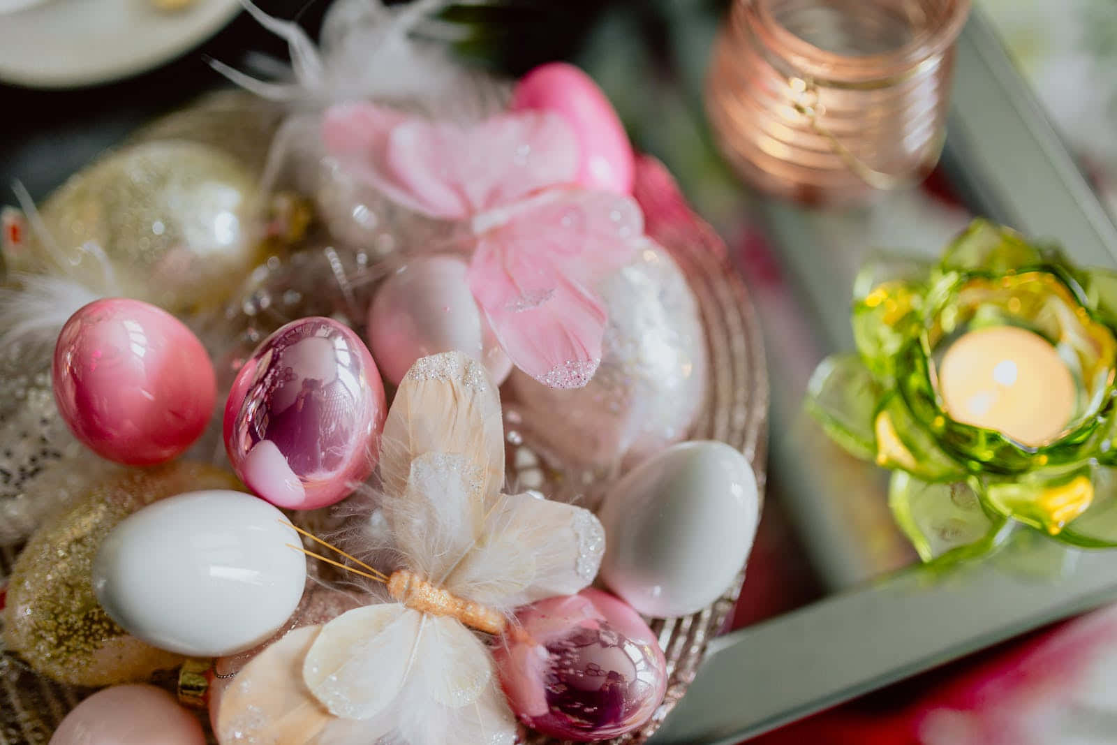 A Table With Easter Eggs And Flowers On It Wallpaper