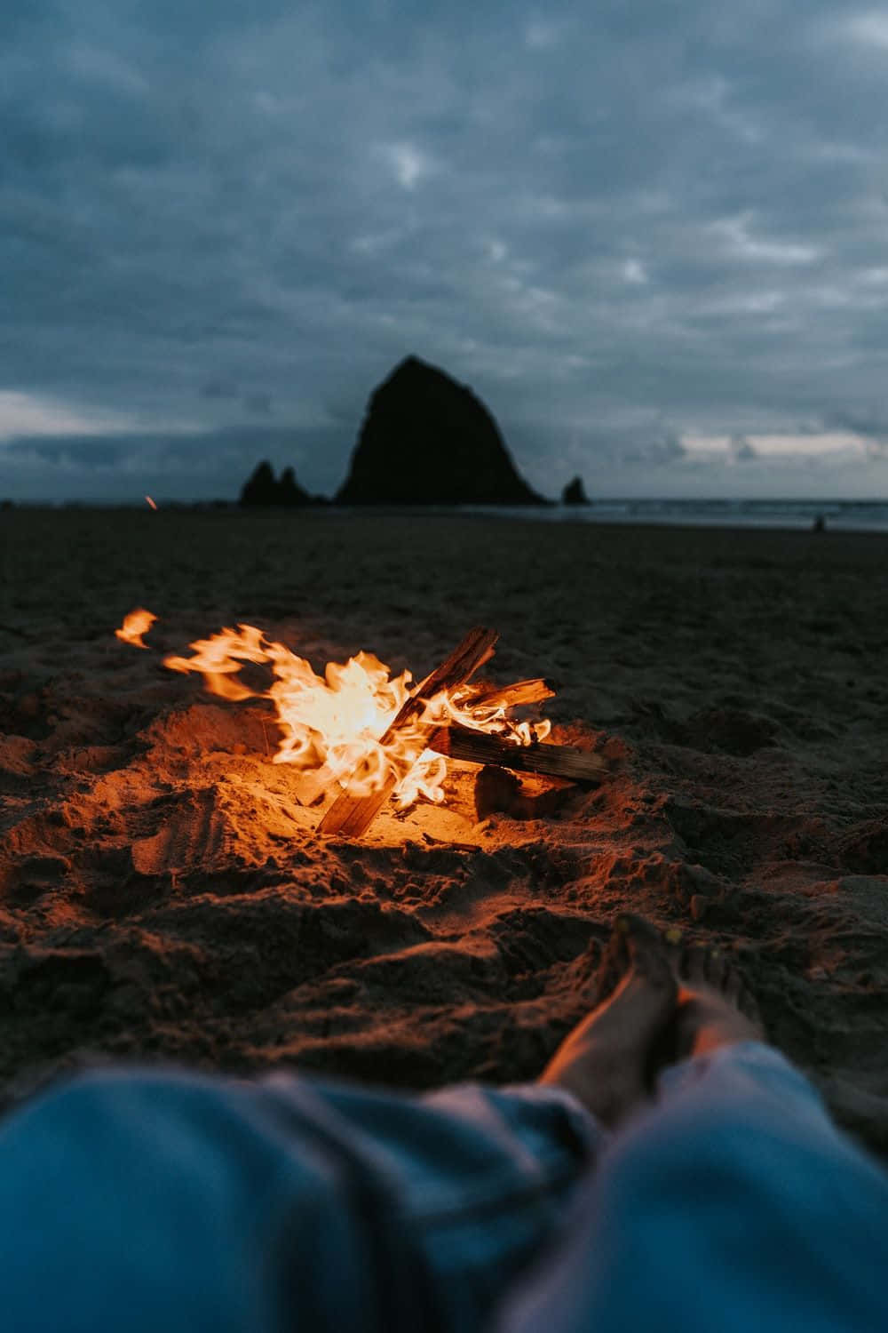 A Tranquil Beach Bonfire Moment Wallpaper