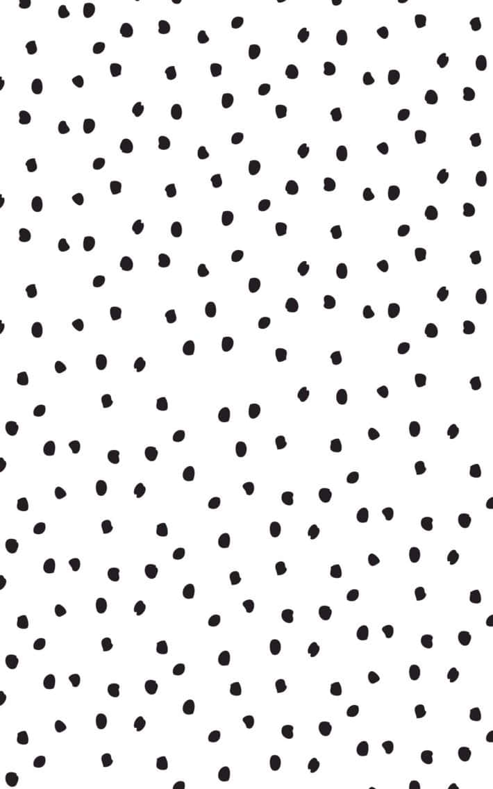 A Unique Pattern Of Black Dots Against A White Background Wallpaper