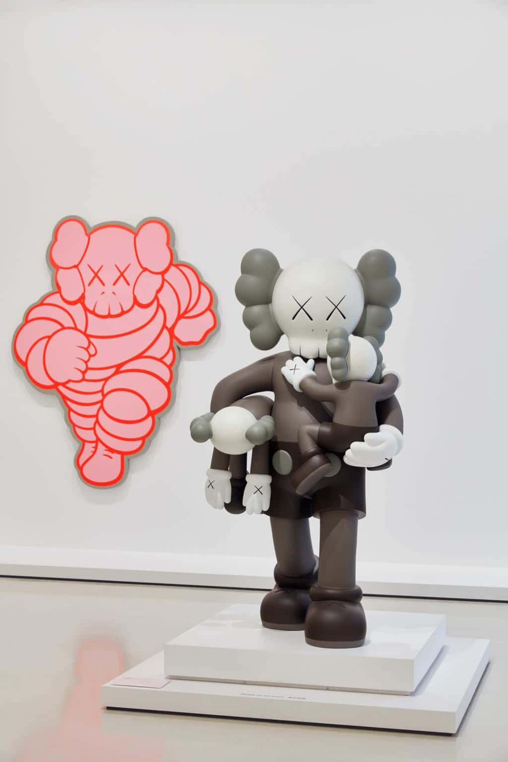 A Vibrant Collection Of Kaws Figures On Display Wallpaper