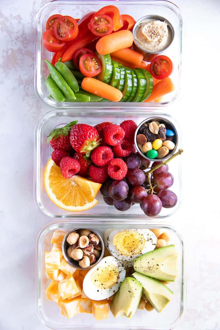 A Vibrant Local Food Assortment On A Wooden Table Wallpaper