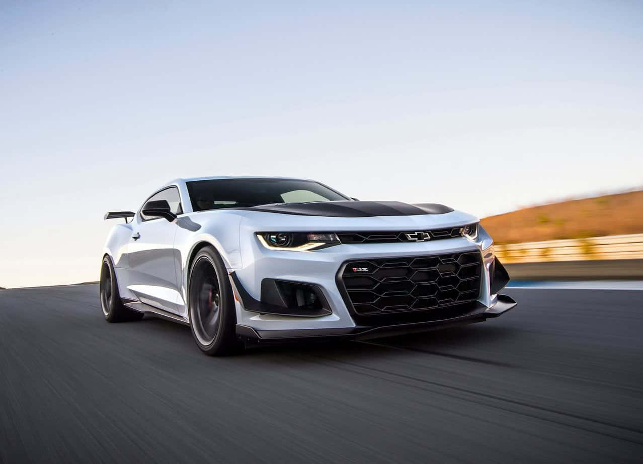 A Vintage, Cool Camaro Car Driving On The Open Road Wallpaper