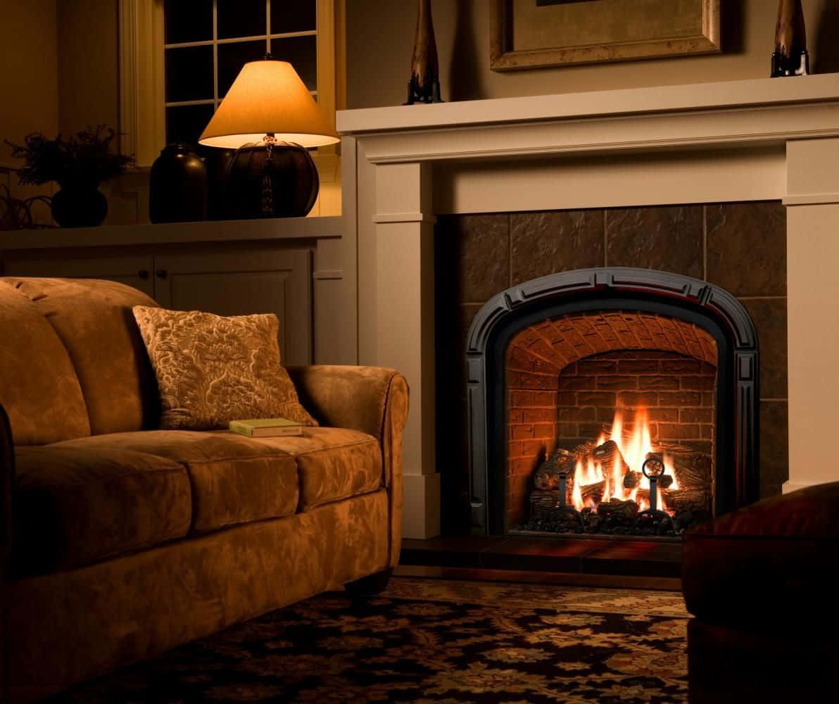 A Warm And Inviting Fireplace With Glowing Fire Wallpaper