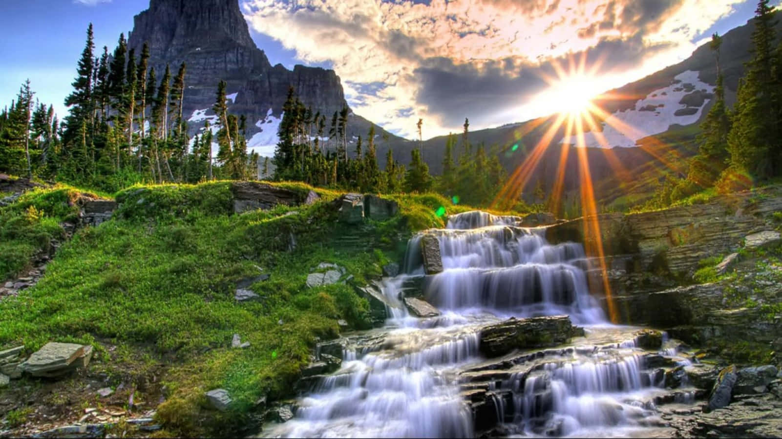 A Waterfall In The Mountains Wallpaper