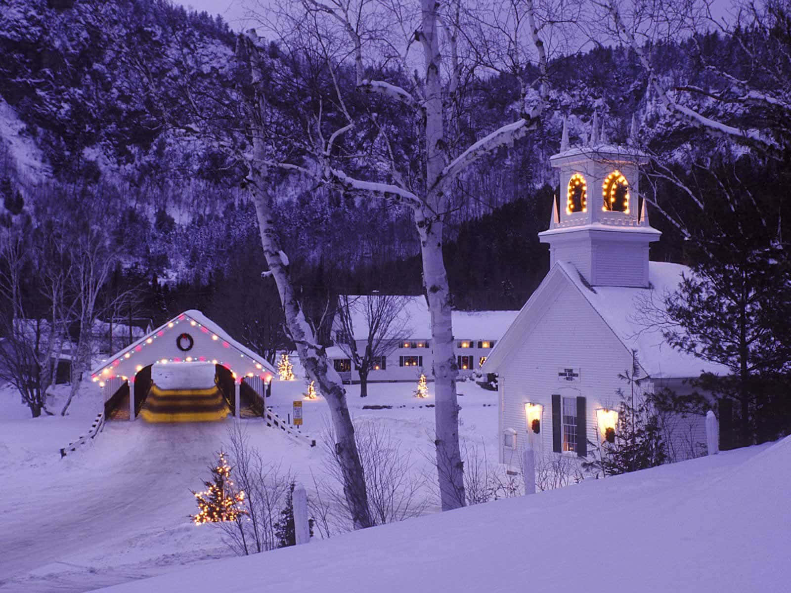 A White Church With Lights On It Wallpaper