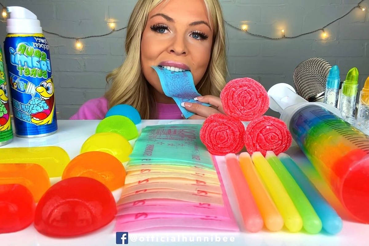 A Woman Is Eating Gum With A Toothbrush Wallpaper