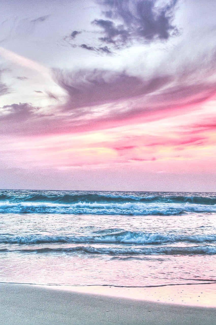 A Woman Is Riding A Surfboard On The Beach Wallpaper