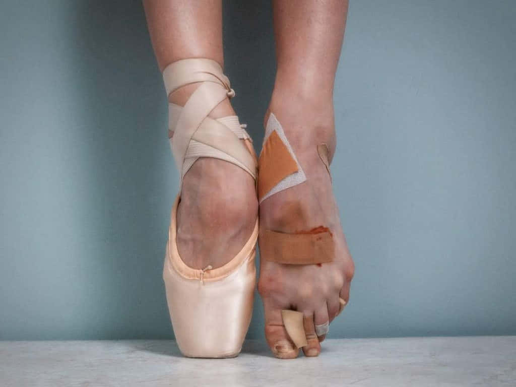 A Woman's Feet With Tape On Them Wallpaper