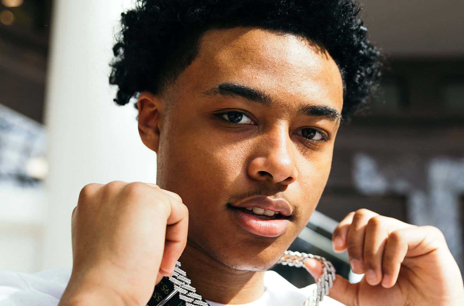 A Young Man With A Necklace On His Neck Wallpaper