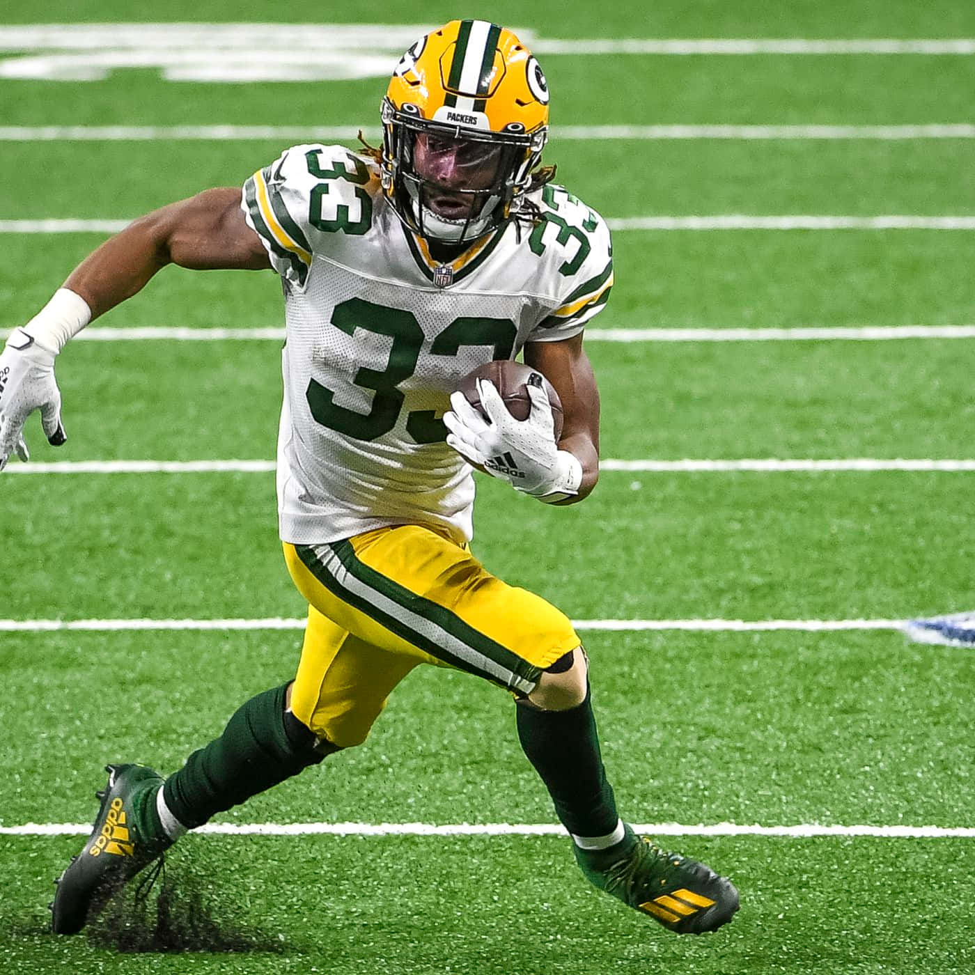 Aaron Jones Celebrates A Touchdown With The Green Bay Packers Wallpaper