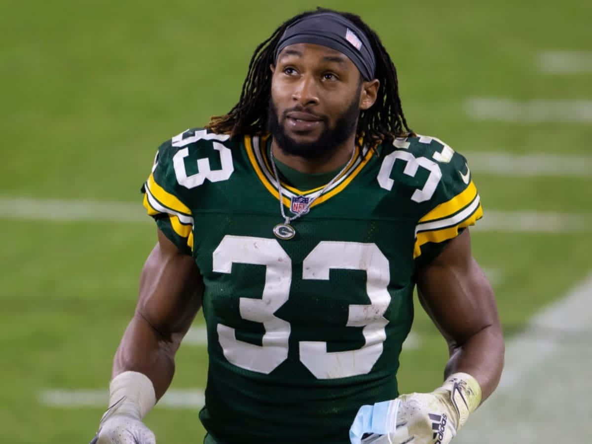 Aaron Jones Of The Green Bay Packers On The Move Wallpaper