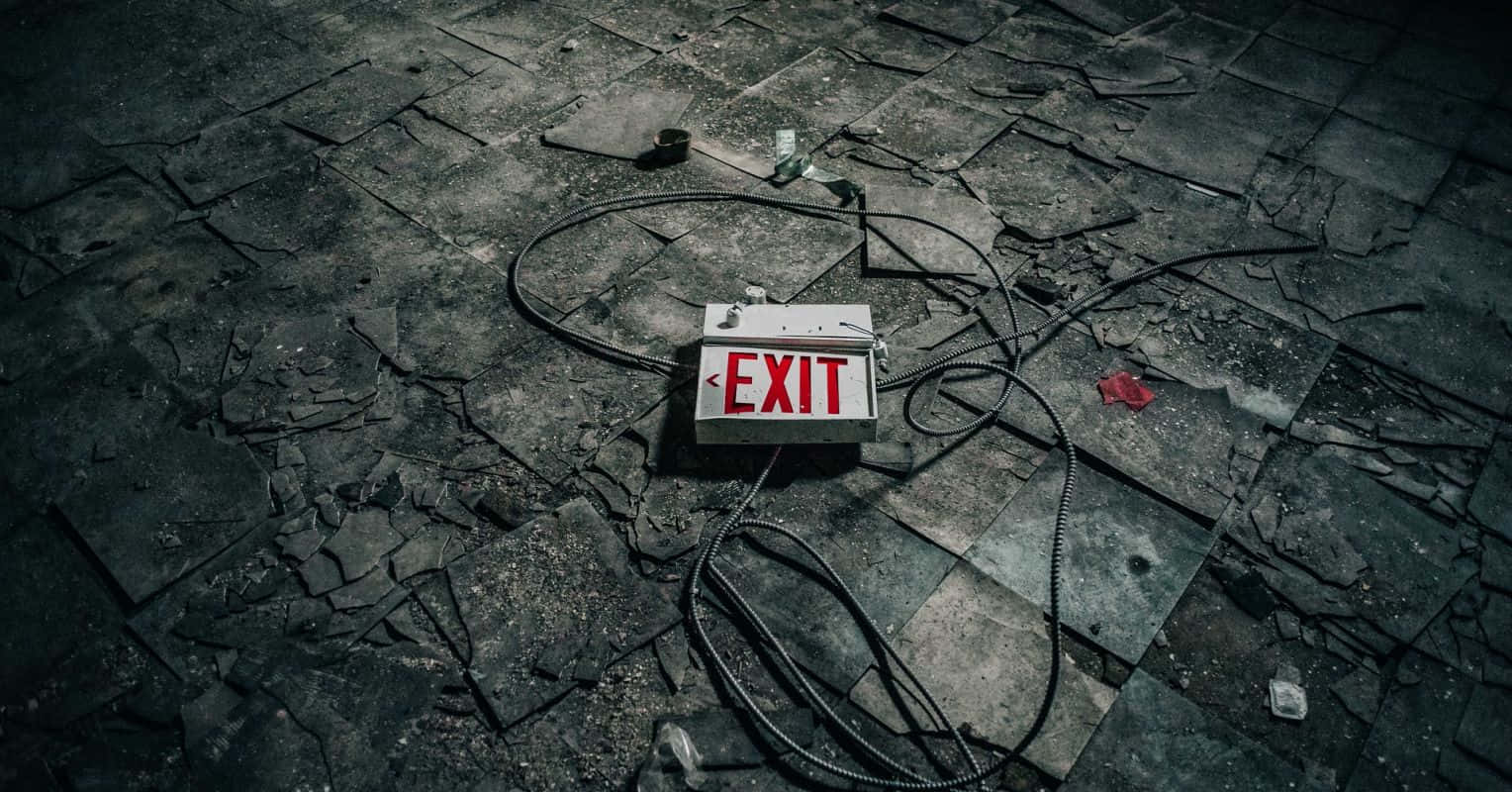 Abandoned Exit Signon Floor Wallpaper