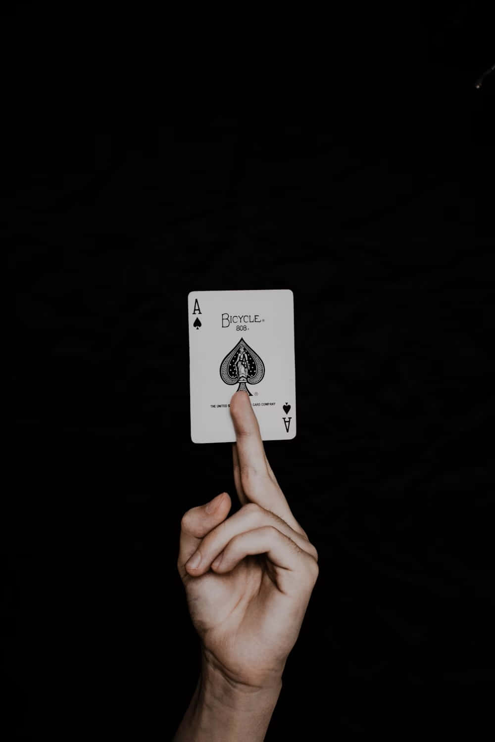 Aceof Spades Balancedon Finger Wallpaper