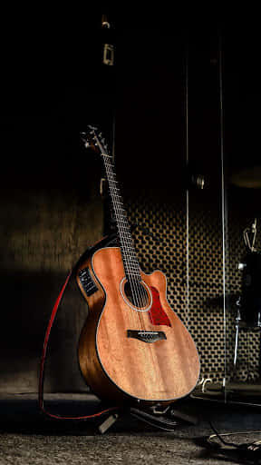 Acoustic Guitarin Studio Setting Wallpaper